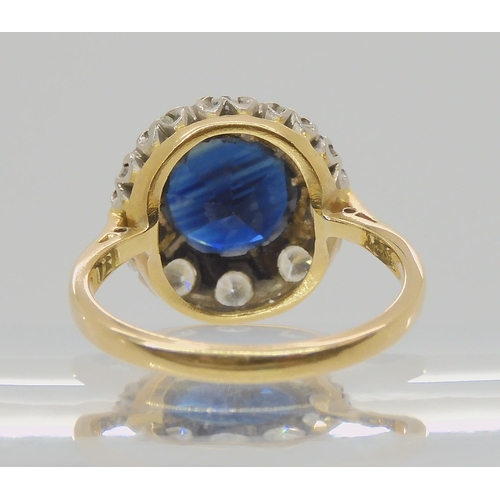 709 - AN 18CT GOLD SAPPHIRE AND DIAMOND RINGsapphire approx 9.1mm, surrounded with estimated approx 0.50ct... 