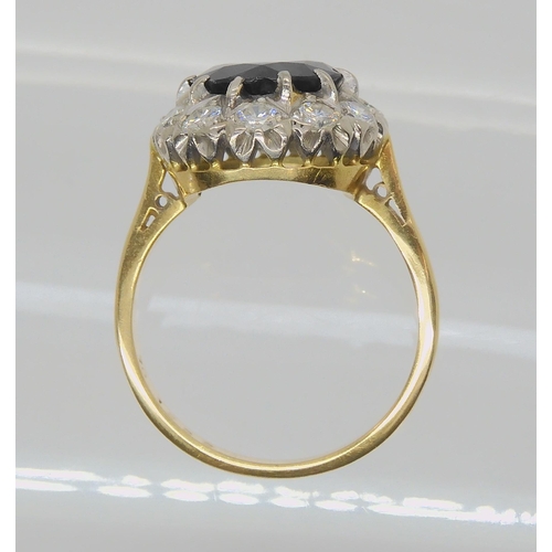 709 - AN 18CT GOLD SAPPHIRE AND DIAMOND RINGsapphire approx 9.1mm, surrounded with estimated approx 0.50ct... 