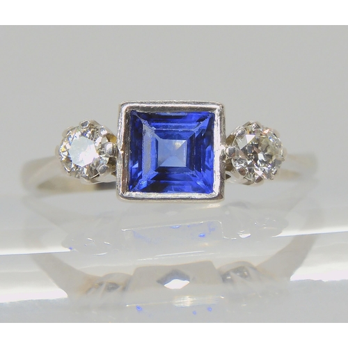 714 - A PLATINUM SAPPHIRE & DIAMOND RINGset with a square cut sapphire with the dimensions of 5mm x 5m... 