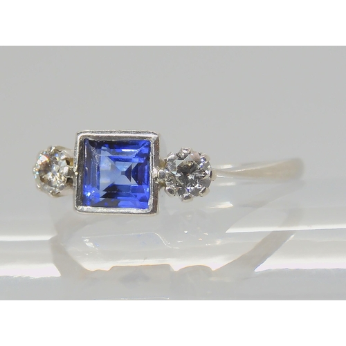 714 - A PLATINUM SAPPHIRE & DIAMOND RINGset with a square cut sapphire with the dimensions of 5mm x 5m... 