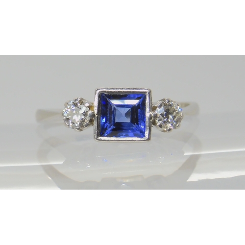 714 - A PLATINUM SAPPHIRE & DIAMOND RINGset with a square cut sapphire with the dimensions of 5mm x 5m... 