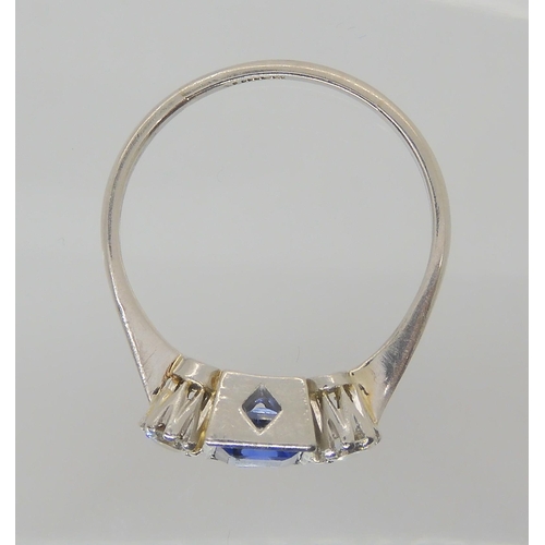 714 - A PLATINUM SAPPHIRE & DIAMOND RINGset with a square cut sapphire with the dimensions of 5mm x 5m... 