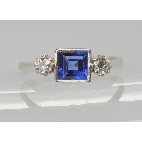 714 - A PLATINUM SAPPHIRE & DIAMOND RINGset with a square cut sapphire with the dimensions of 5mm x 5m... 