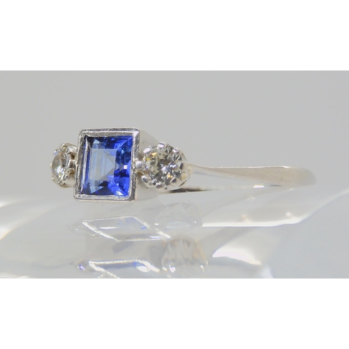 714 - A PLATINUM SAPPHIRE & DIAMOND RINGset with a square cut sapphire with the dimensions of 5mm x 5m... 