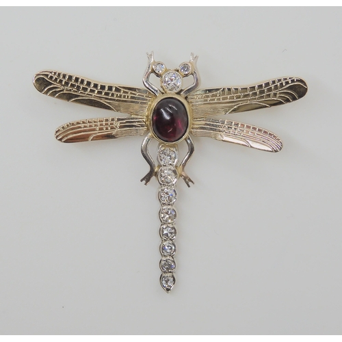 718 - A 9CT WHITE GOLD DRAGONFLY BROOCHthe tail, head and eyes are set with diamonds, to an estimated appr... 