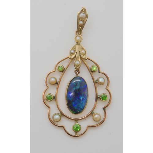 719 - A BLACK OPAL EDWARDIAN PENDANTset with demantoid garnets and split pearls, the solid piece of black ... 