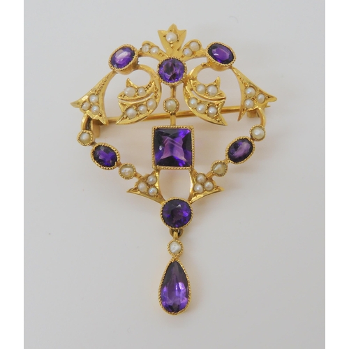 720 - A 9CT GOLD EDWARDIAN PENDANT BROOCHset with square, oval, pear shaped, and round amethysts and split... 