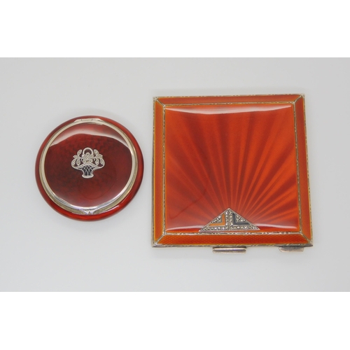 725 - TWO ENAMELLED POWDER COMPACTSa deep orange guilloche enamelled silver square compact with triangular... 