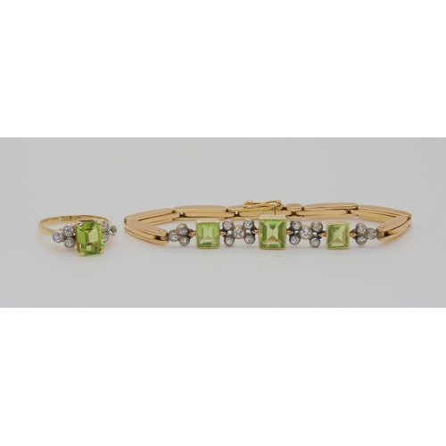 726 - A PERIDOT AND DIAMOND BRACELET & MATCHING RINGthe yellow metal expanding bracelet is stamped Lon... 