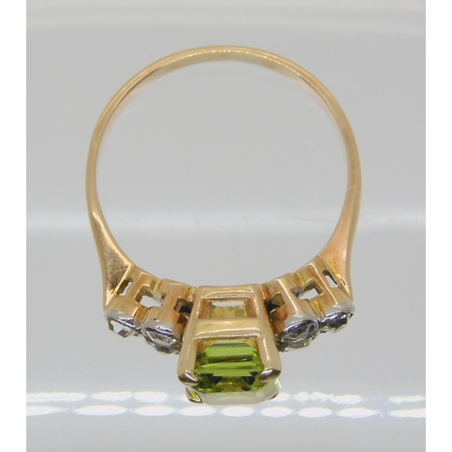 726 - A PERIDOT AND DIAMOND BRACELET & MATCHING RINGthe yellow metal expanding bracelet is stamped Lon... 