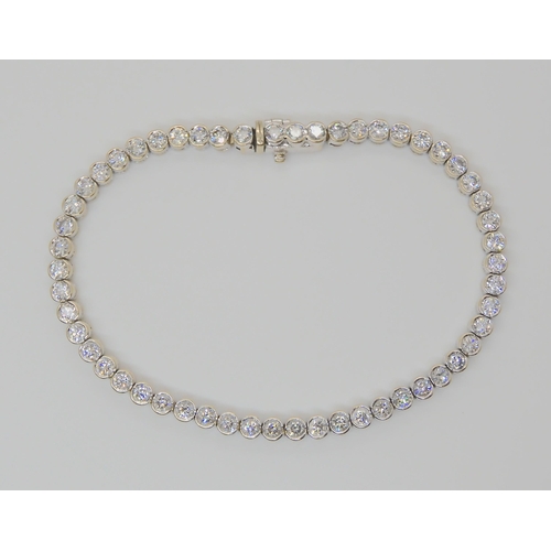 728 - AN 18CT WHITE GOLD DIAMOND TENNIS BRACELETset with estimated approx 4.5cts of brilliant cut diamonds... 