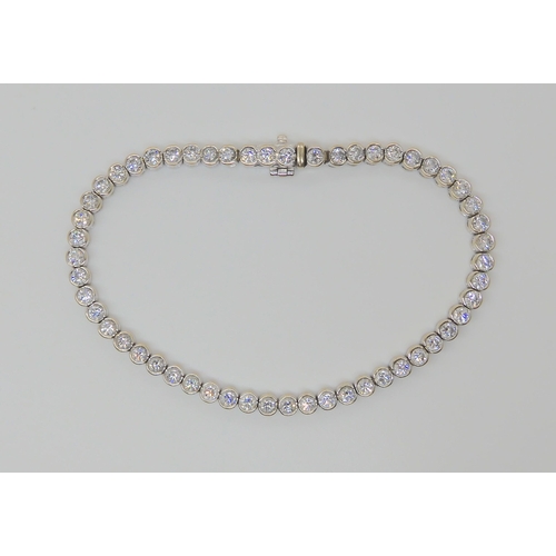 728 - AN 18CT WHITE GOLD DIAMOND TENNIS BRACELETset with estimated approx 4.5cts of brilliant cut diamonds... 