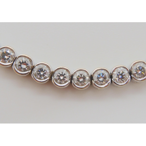 728 - AN 18CT WHITE GOLD DIAMOND TENNIS BRACELETset with estimated approx 4.5cts of brilliant cut diamonds... 