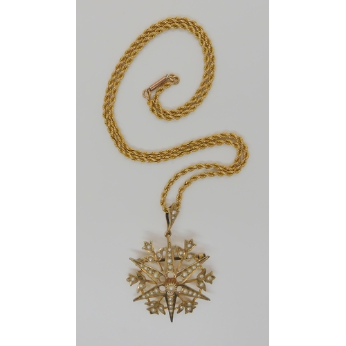 733 - A 9CT GOLD PEARL SET SNOW FLAKE PENDANT BROOCHset throughout with split pearls, diameter approx 3.4c... 