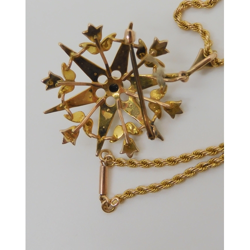 733 - A 9CT GOLD PEARL SET SNOW FLAKE PENDANT BROOCHset throughout with split pearls, diameter approx 3.4c... 