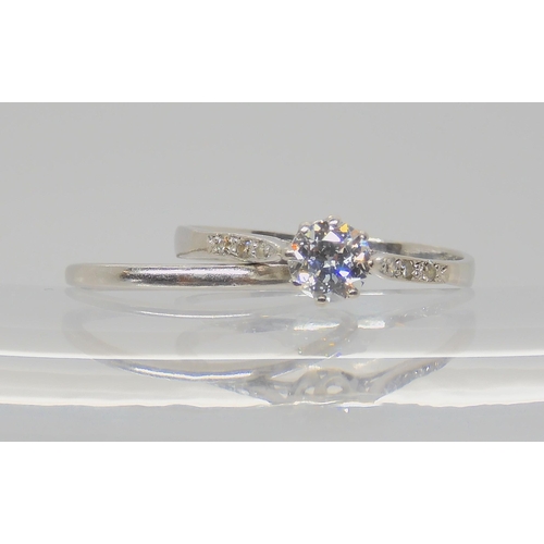 739 - TWO VINTAGE PLATINUM RINGSa diamond solitaire of estimated approx 0.40cts, with further diamond acce... 