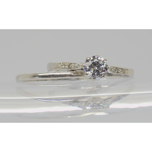 739 - TWO VINTAGE PLATINUM RINGSa diamond solitaire of estimated approx 0.40cts, with further diamond acce... 