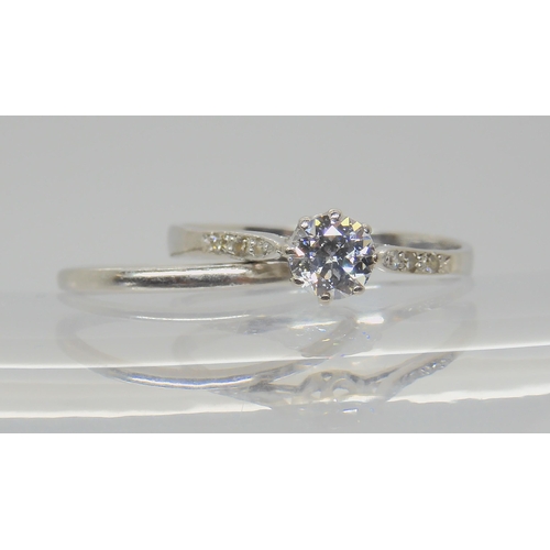 739 - TWO VINTAGE PLATINUM RINGSa diamond solitaire of estimated approx 0.40cts, with further diamond acce... 