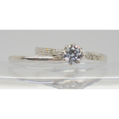 739 - TWO VINTAGE PLATINUM RINGSa diamond solitaire of estimated approx 0.40cts, with further diamond acce... 