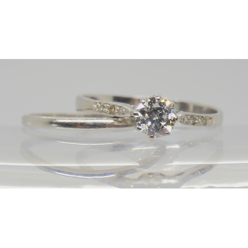 739 - TWO VINTAGE PLATINUM RINGSa diamond solitaire of estimated approx 0.40cts, with further diamond acce... 