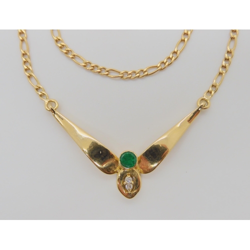 740 - AN 18CT GOLD EMERALD AND DIAMOND NECKLETItalian made, with a figaro chain, length 48cm, approx diame... 