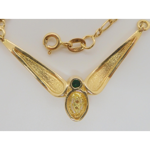 740 - AN 18CT GOLD EMERALD AND DIAMOND NECKLETItalian made, with a figaro chain, length 48cm, approx diame... 