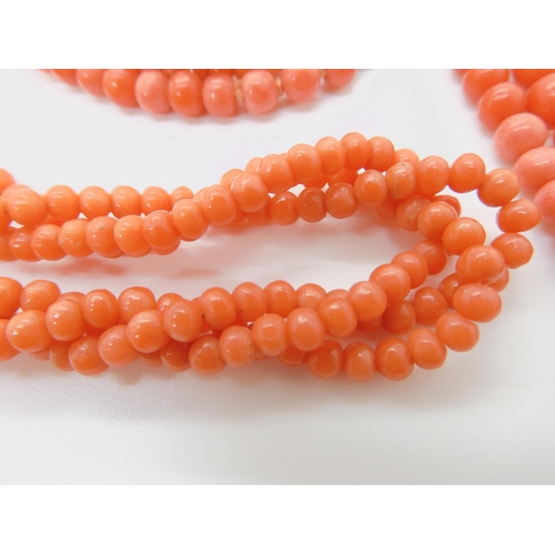 746 - TWO STRINGS OF CORAL BEADSa double string of tapered coral beads, largest bead approx 6mm, length of... 