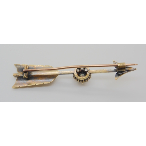 749 - A PEARL AND DIAMOND SET ARROW BROOCHmounted in yellow metal, with engraved detail, a single pearl su... 