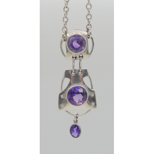 752 - A MURRLE BENNETT AMETHYST PENDANTwith three sections, each set with an amethyst, total length of the... 