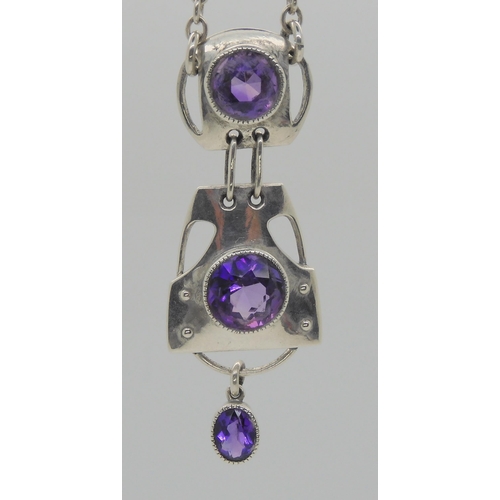 752 - A MURRLE BENNETT AMETHYST PENDANTwith three sections, each set with an amethyst, total length of the... 