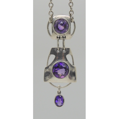 752 - A MURRLE BENNETT AMETHYST PENDANTwith three sections, each set with an amethyst, total length of the... 