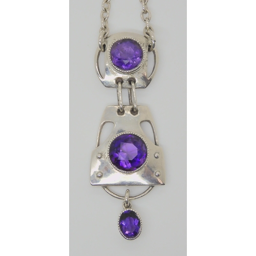 752 - A MURRLE BENNETT AMETHYST PENDANTwith three sections, each set with an amethyst, total length of the... 