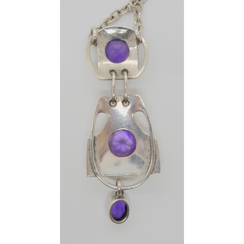 752 - A MURRLE BENNETT AMETHYST PENDANTwith three sections, each set with an amethyst, total length of the... 