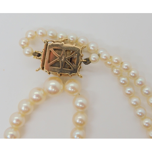 754 - A STRING OF PEARLS with a 9ct gold garnet and pearl clasp, stamped C&F for Cropp & Farr Ltd,... 