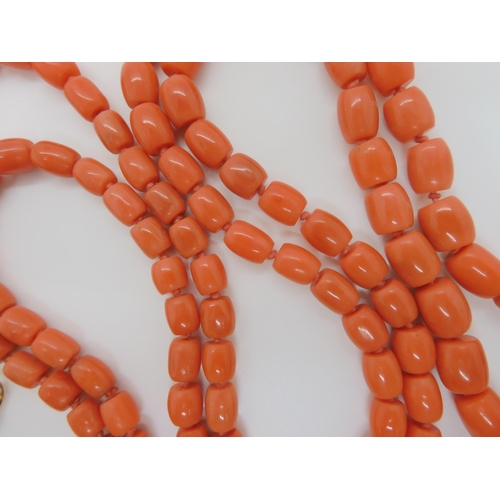 757 - A STRING OF CORAL BARREL SHAPED BEADSlargest bead approx 12.3mm x 9.5mm, length of the long string a... 