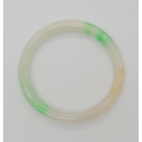 761 - A CHINESE GREEN HARDSTONE BANGLEmainly white with green details, inner diameter 6cm, thickness 0.9cm... 