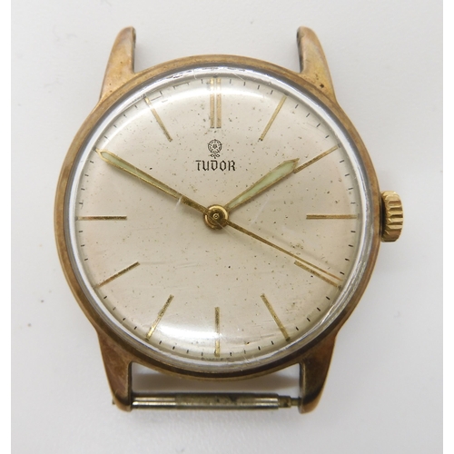 846 - A 9CT GOLD VINTAGE TUDOR WATCH HEADwith cream dial, Tudor Rose logo, gold coloured baton numerals an... 