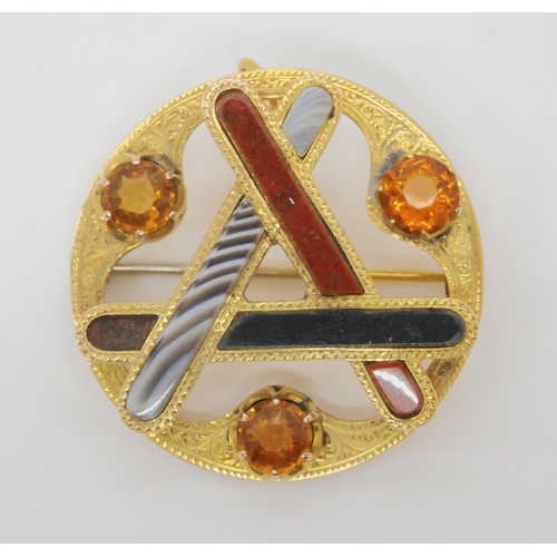 737 - A SCOTTISH AGATE BROOCHfurther set with citrines to the engraved yellow metal mount, diameter 3.5cm... 