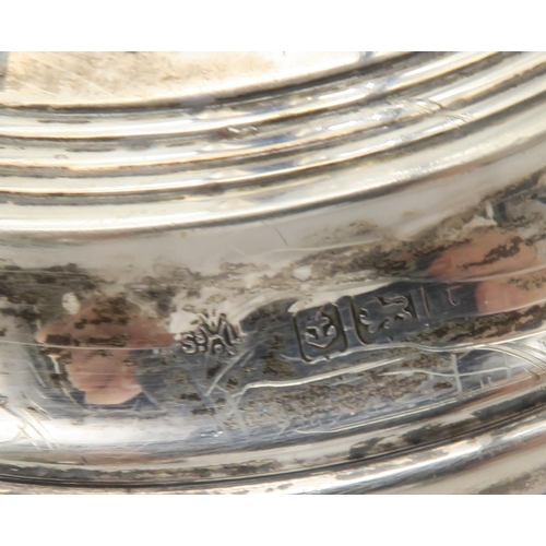 401 - A collection of silver including a pair of silver candle sticks, of tapering form with stepped circu... 