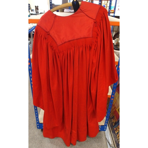 214 - A red university gown, black tail coat and other items