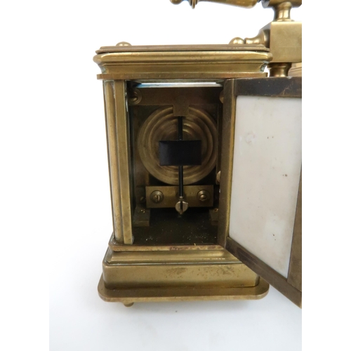 156 - A 19TH CENTURY FRENCH MINIATURE BRASS AND PORCELAIN CARRIAGE CLOCK AND BAROMETEReach with a porcelai... 