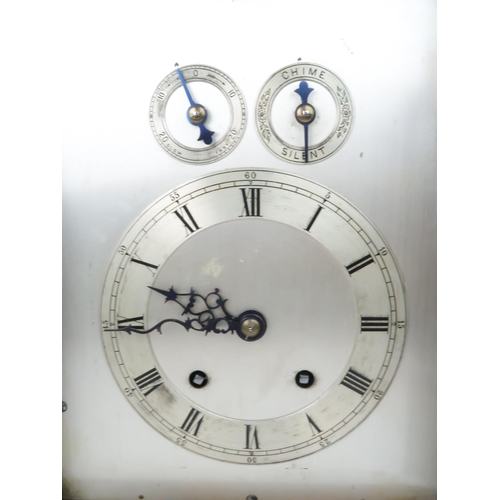 167 - A LATE 19TH CENTURY CHIMING MANTLE CLOCKthe arched silvered dial with silvered chapter ring and Roma... 