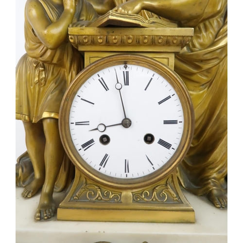 168 - A 19TH CENTURY FRENCH GILT BRONZE MANTLE CLOCKmodelled as a scholar and boy looking at books, with a... 