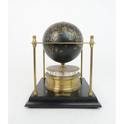 169 - A ROYAL GEOGRAPHICAL SOCIETY WORLD CLOCKwith rotating terrestrial globe and gilt metal chassis, upon... 