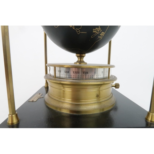 169 - A ROYAL GEOGRAPHICAL SOCIETY WORLD CLOCKwith rotating terrestrial globe and gilt metal chassis, upon... 