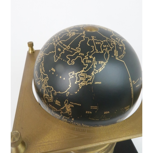 169 - A ROYAL GEOGRAPHICAL SOCIETY WORLD CLOCKwith rotating terrestrial globe and gilt metal chassis, upon... 