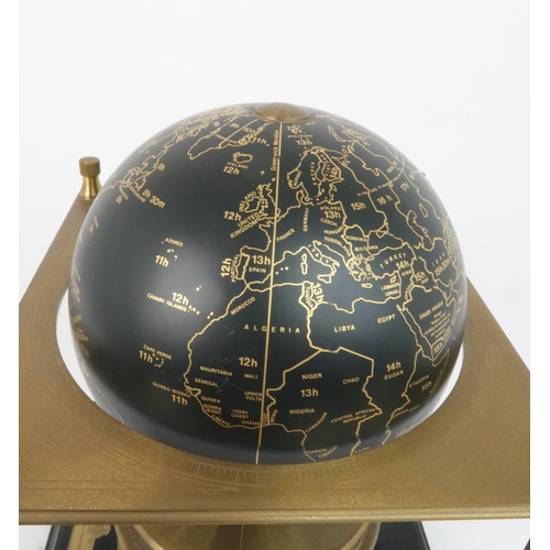 169 - A ROYAL GEOGRAPHICAL SOCIETY WORLD CLOCKwith rotating terrestrial globe and gilt metal chassis, upon... 