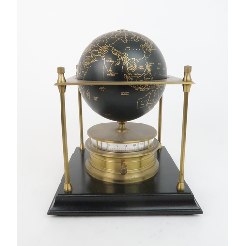 169 - A ROYAL GEOGRAPHICAL SOCIETY WORLD CLOCKwith rotating terrestrial globe and gilt metal chassis, upon... 