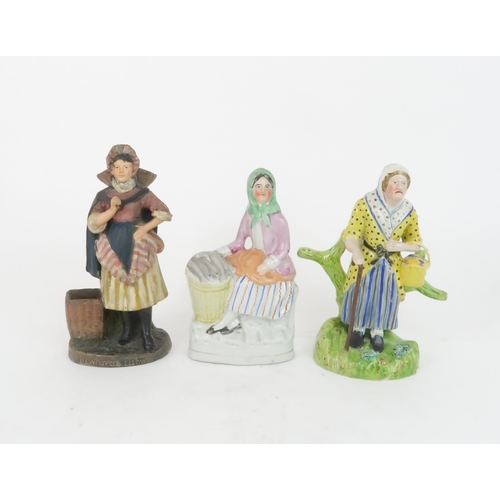 181 - THREE PORTOBELLO TYPE FLATBACKSmodelled as fishwives, a Newhaven fishwife figure, and another in the... 