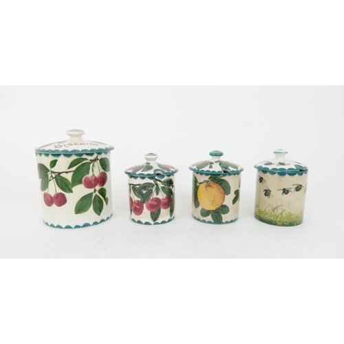 183 - A WEMYSS BISCUIT JAR AND COVERpainted with cherries, a Cherry preserve pot, a orange painted ma... 